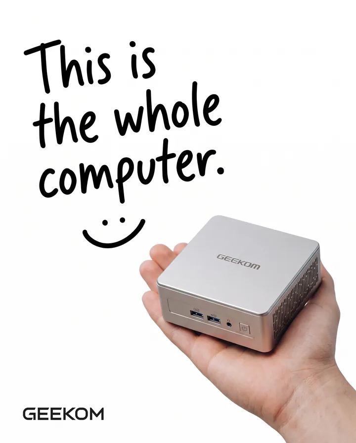 Spec ad for GEEKOM on a white background. Handwritten text says This is the whole computer, with a smiley, above a hand holding a small silver GEEKOM mini PC in one palm, with the GEEKOM logo in the corner.